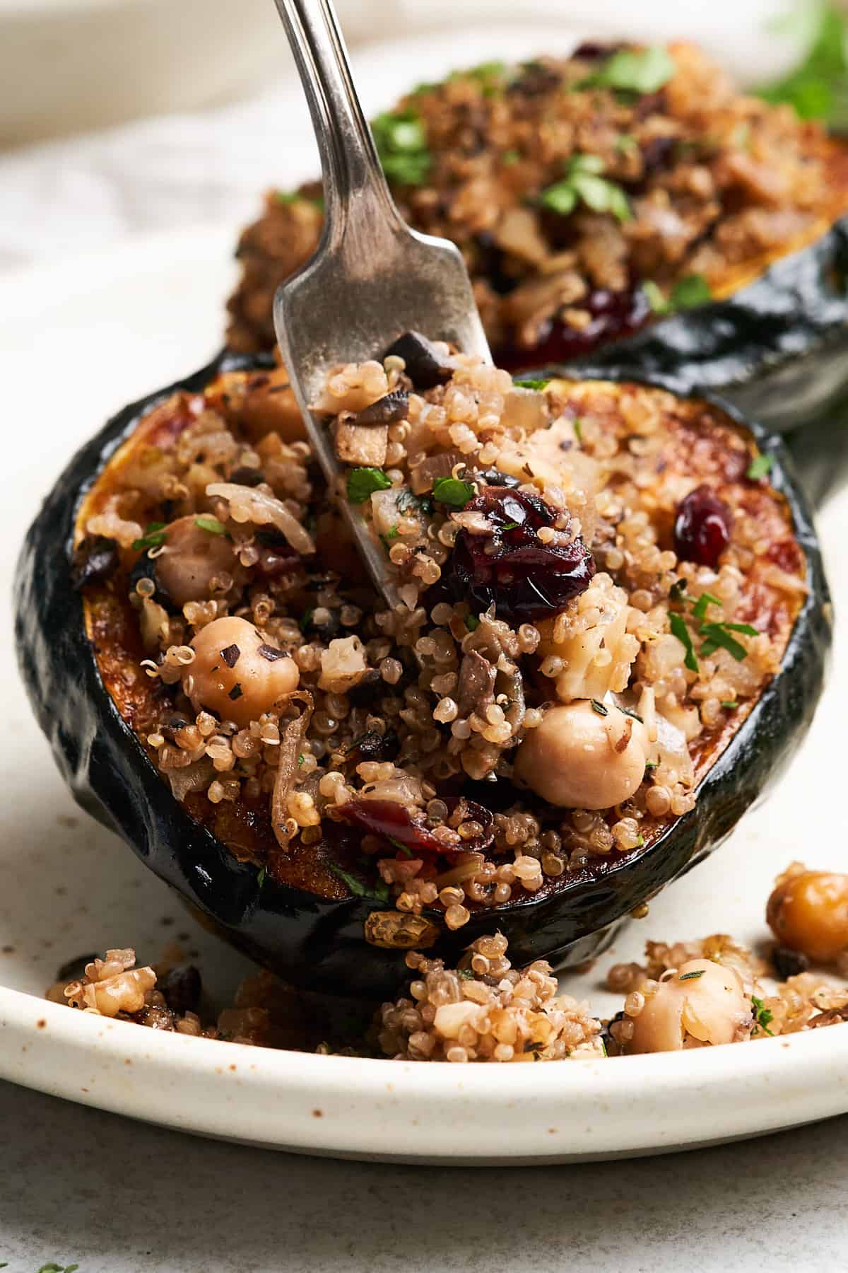 Vegan stuffed acorn squash on a fork.
