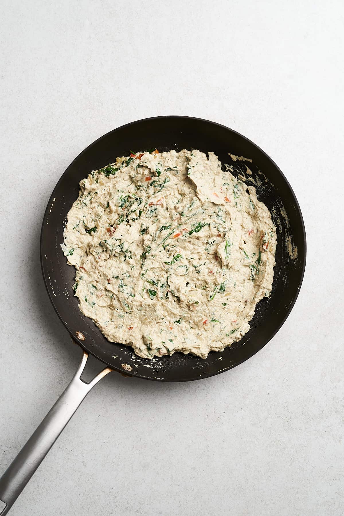 Cream cheese in a frying pan.
