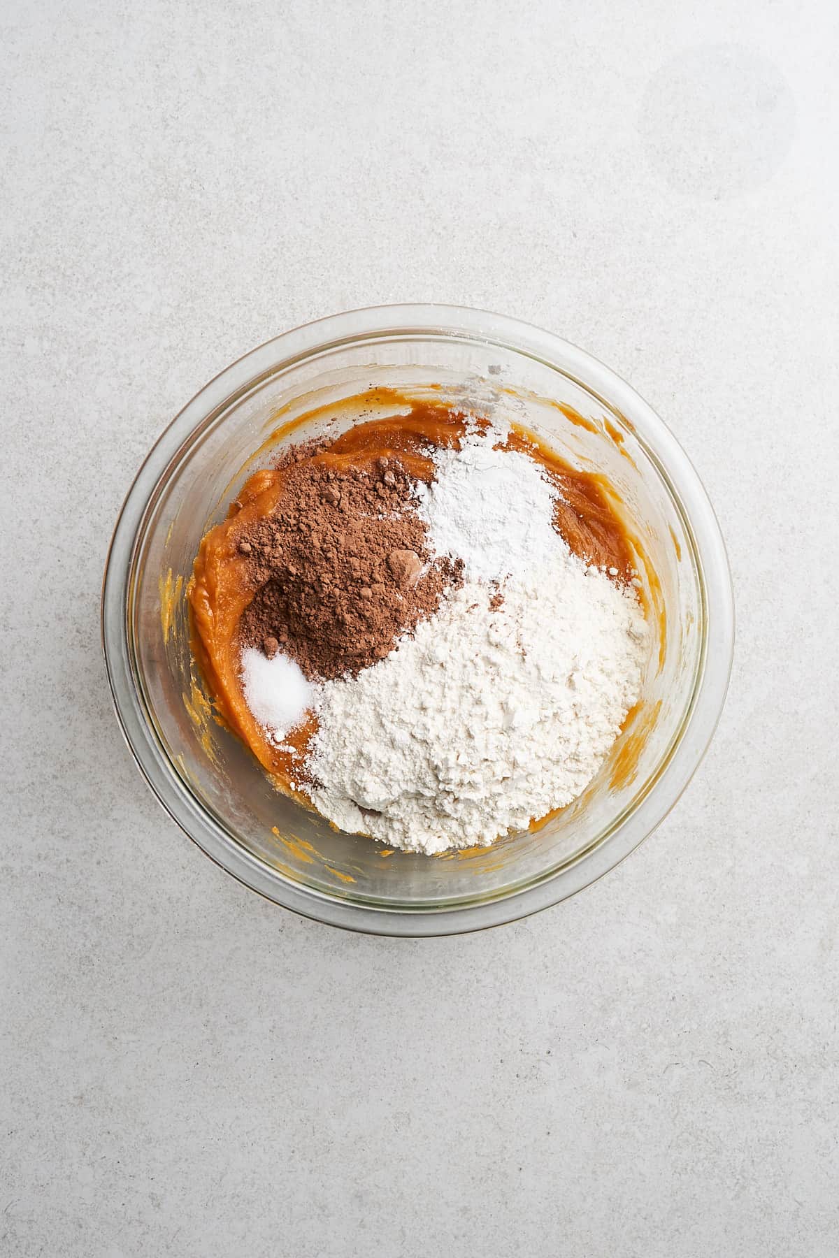 Sweet potato purée with ingredients in a bowl.