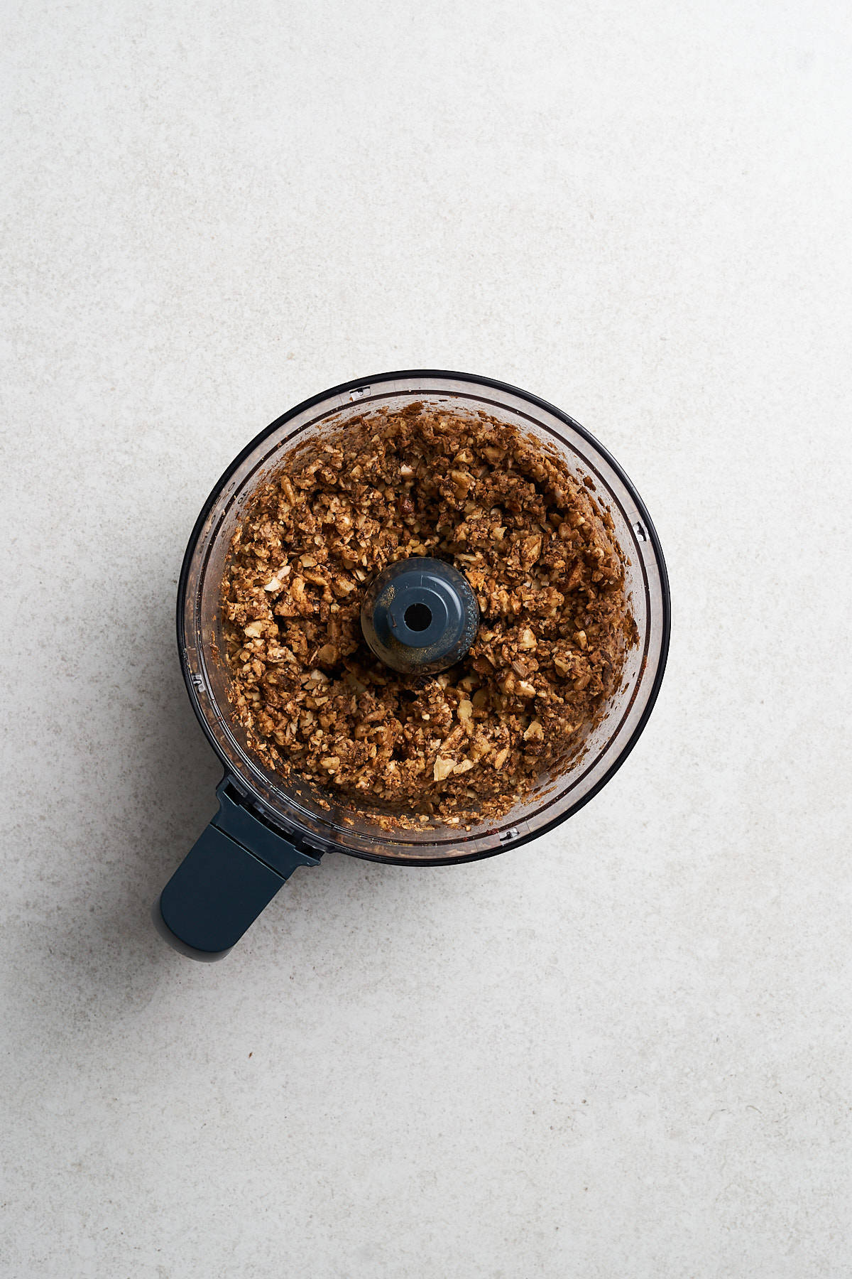 Mixture of Walnut Meat in a food processor.