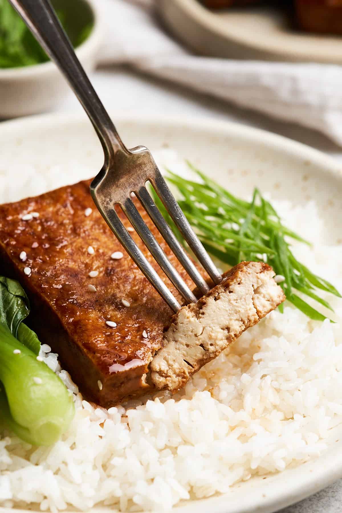 Tofu steak on a fork.
