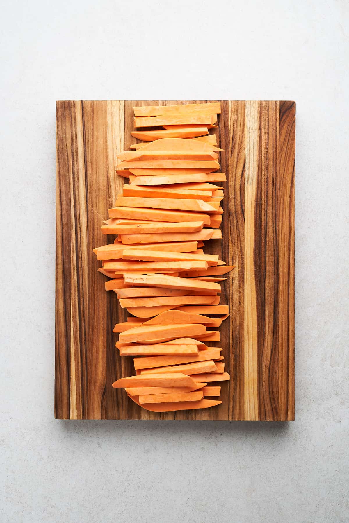 Sliced sweet potatoes in thick planks.
