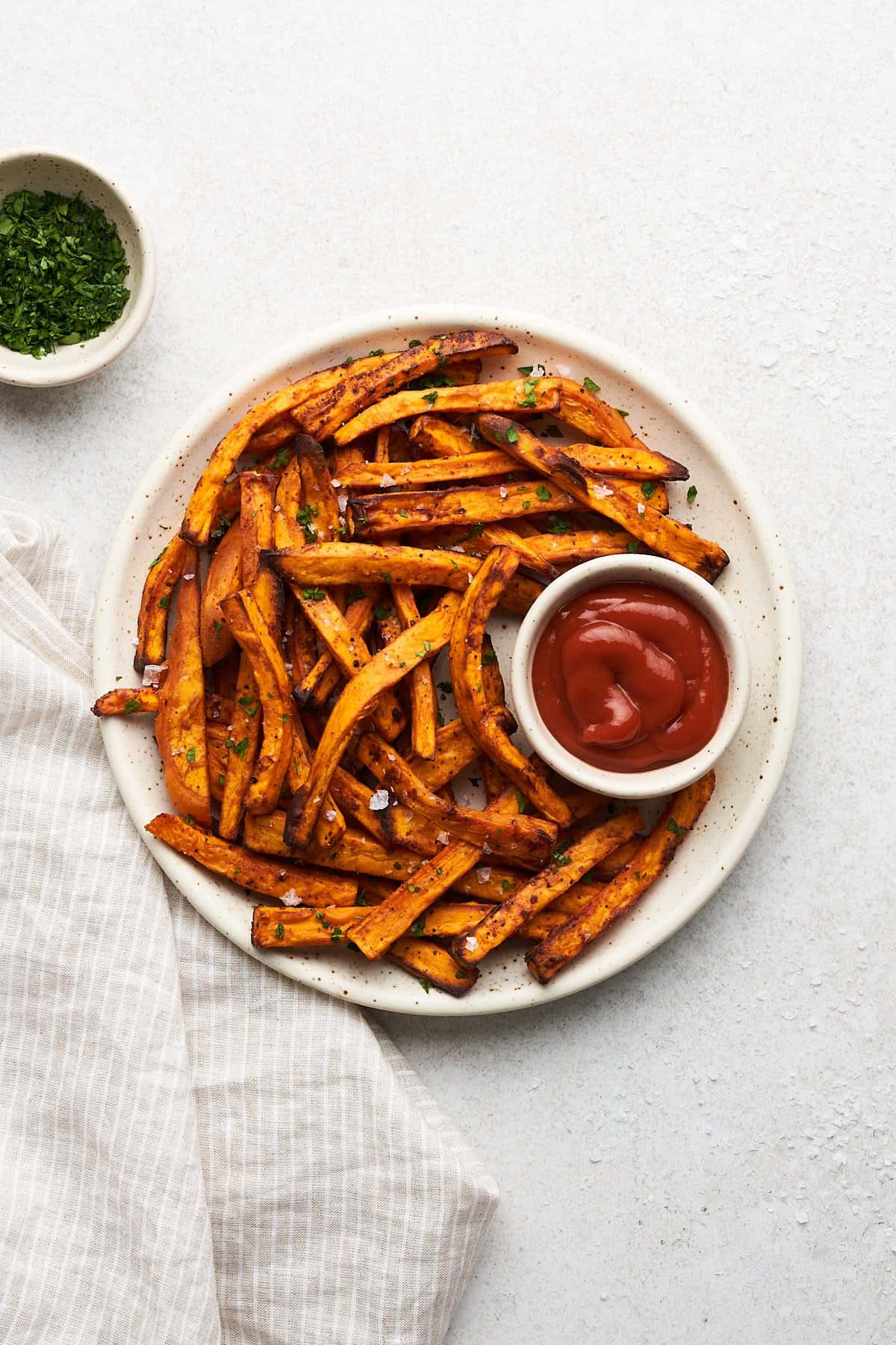 Air fryer sweet potato fries on a plate.