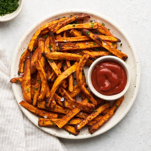Air fryer sweet potato fries on a plate.
